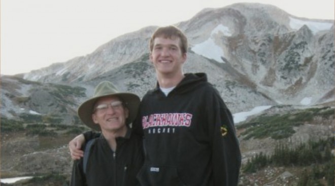 If you're way taller than your father, don't stand right next to him. It overpowers the landscape's "Dwarfing" effect.